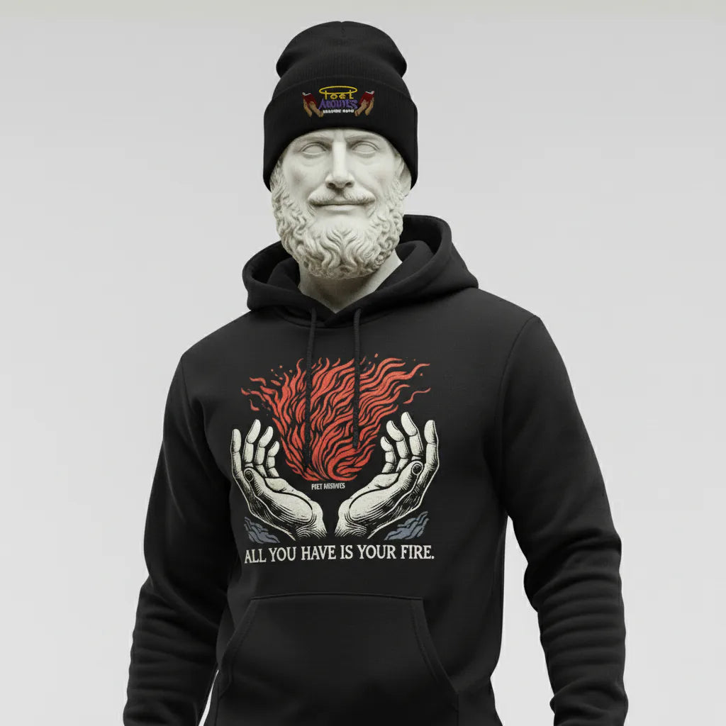 Person wearing a black hoodie with a graphic design and text, standing against a plain background