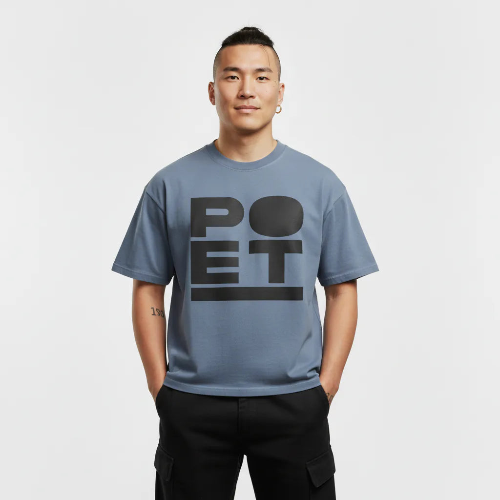 Person wearing a blue t-shirt with 'POET' printed on it against a white background