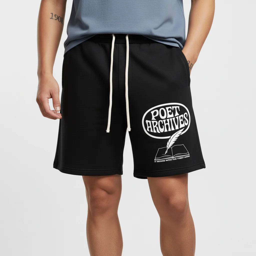 Black shorts with 'Poet Archives' logo worn by a person on a light gray background