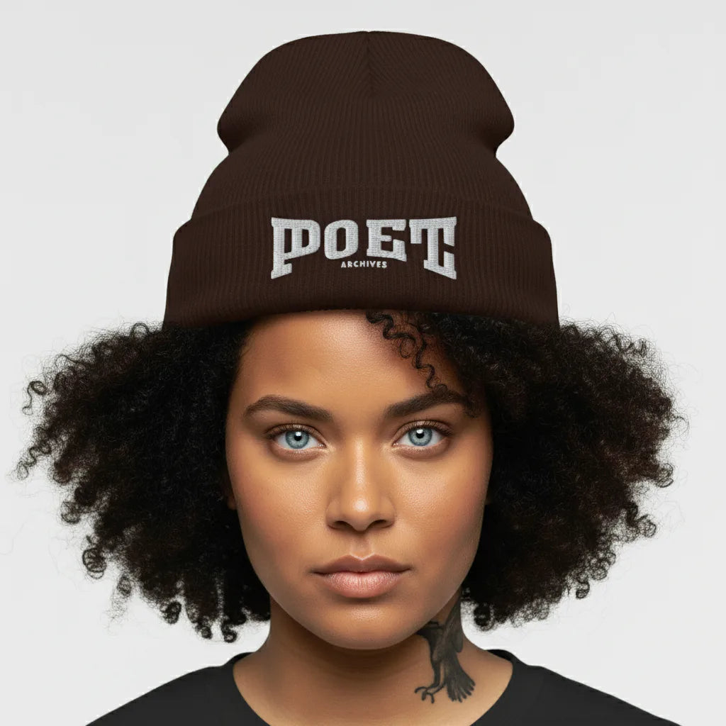 Person wearing a brown beanie with 'POET' text on a plain background