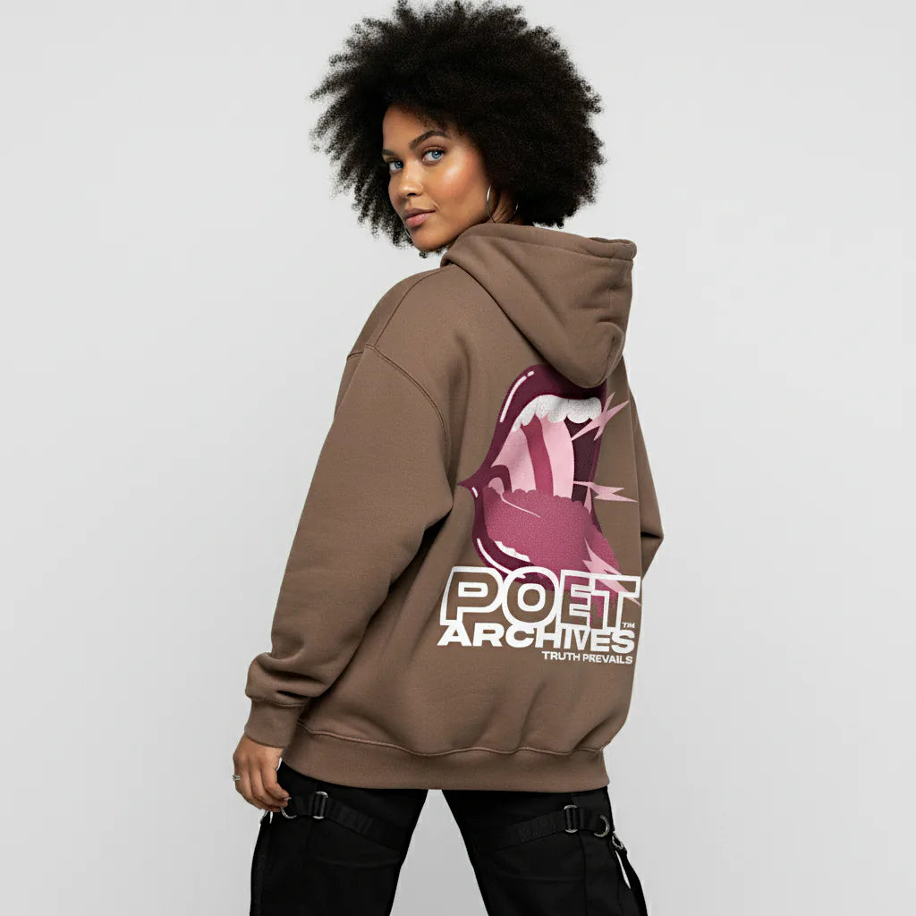 Person wearing a brown hoodie with a logo and text on the back against a light gray background