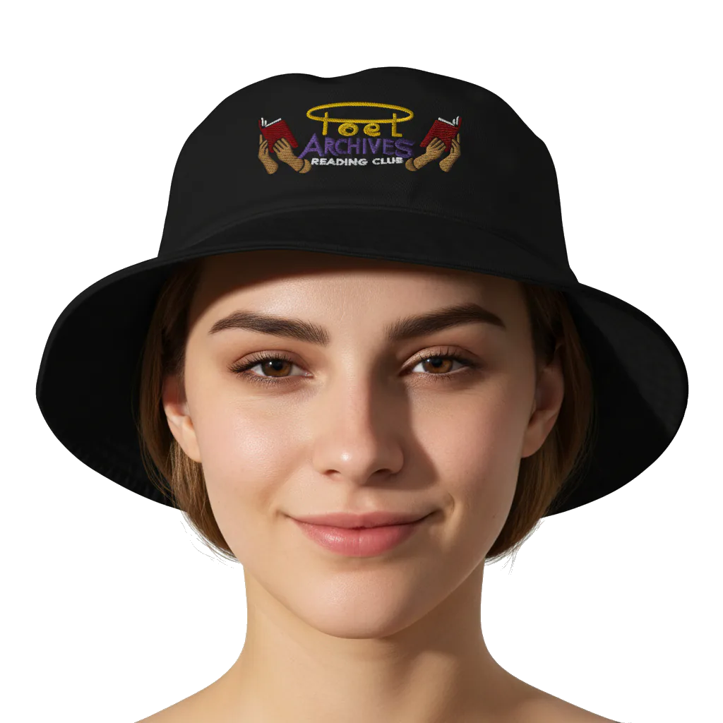Person wearing a black bucket hat with embroidered design on a white background