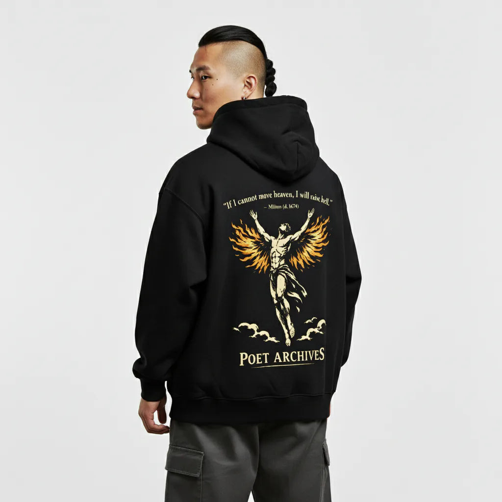 Person wearing a black hoodie with a graphic design and text on the back, on a light gray background