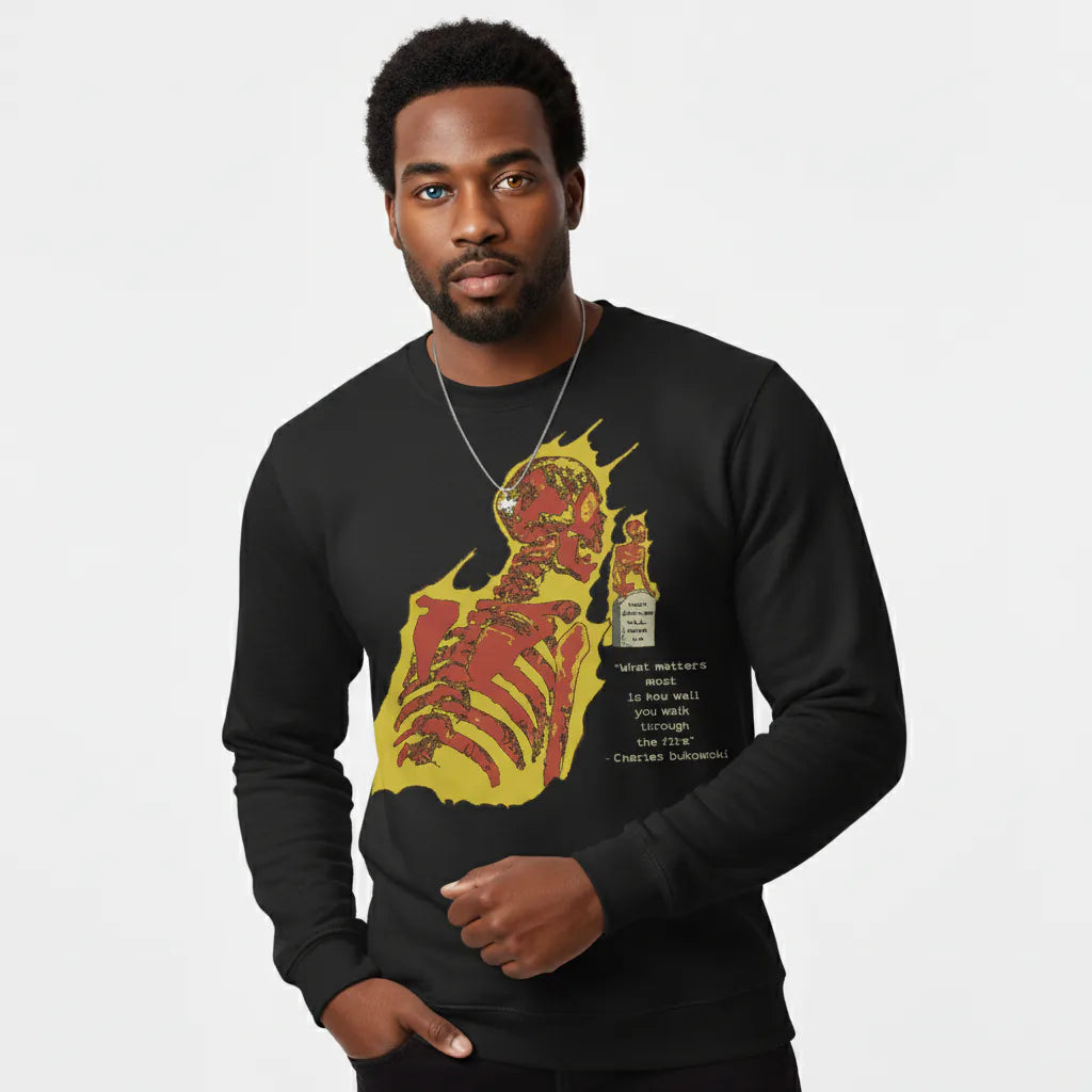 Man wearing a black sweatshirt with a graphic design on a white background