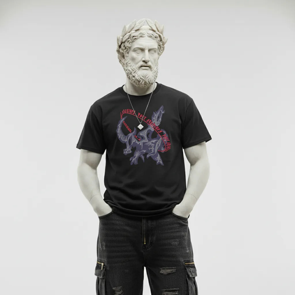 Man wearing a black t-shirt with a graphic design on a plain background