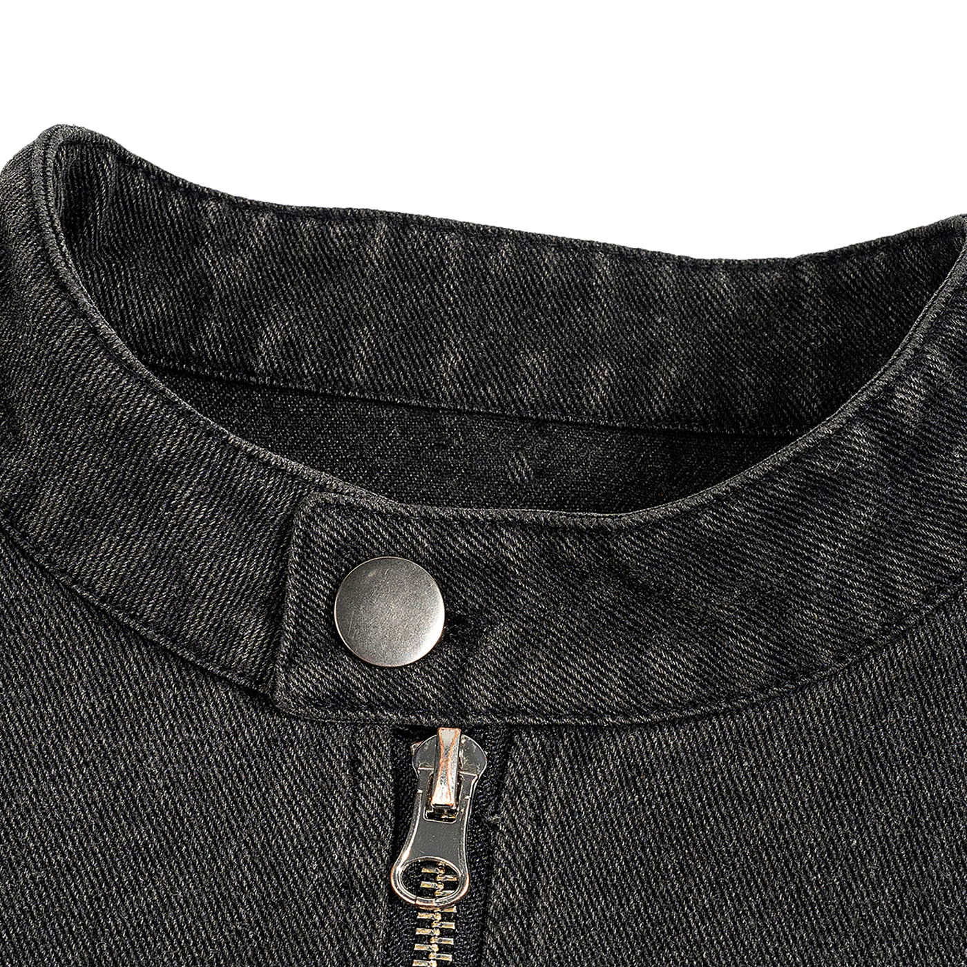 Close-up of a black denim collar with a button and zipper on a white background