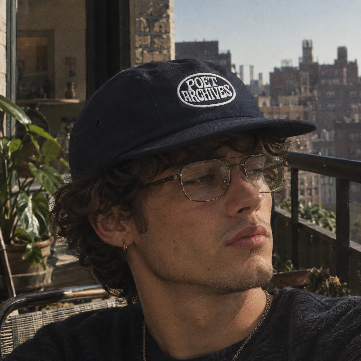 5-panel cap with 'Poet Archives' logo, available in navy, black, and green, from Poet Archives
