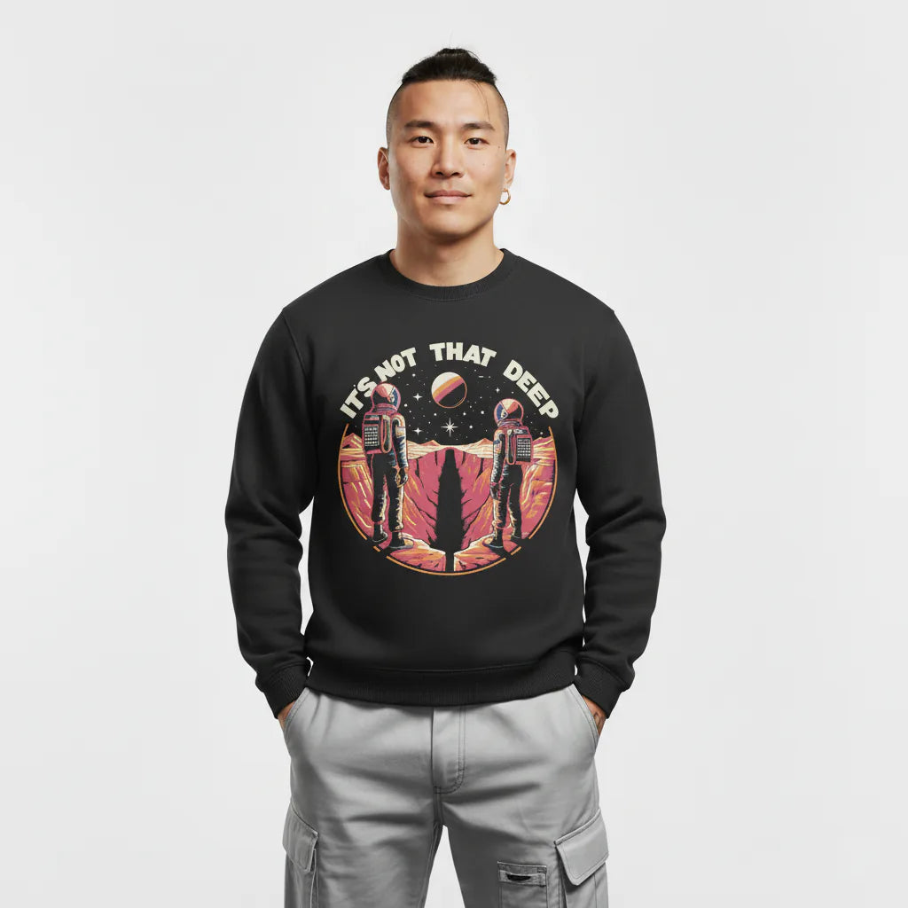 Person wearing a black sweatshirt with space-themed design and text on a white background