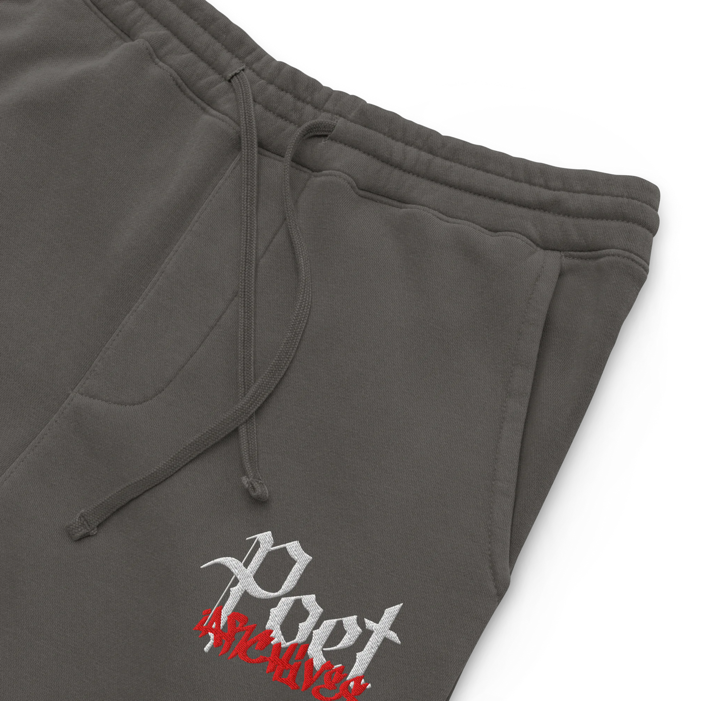 Gray sweatpants with a logo on the leg against a white background