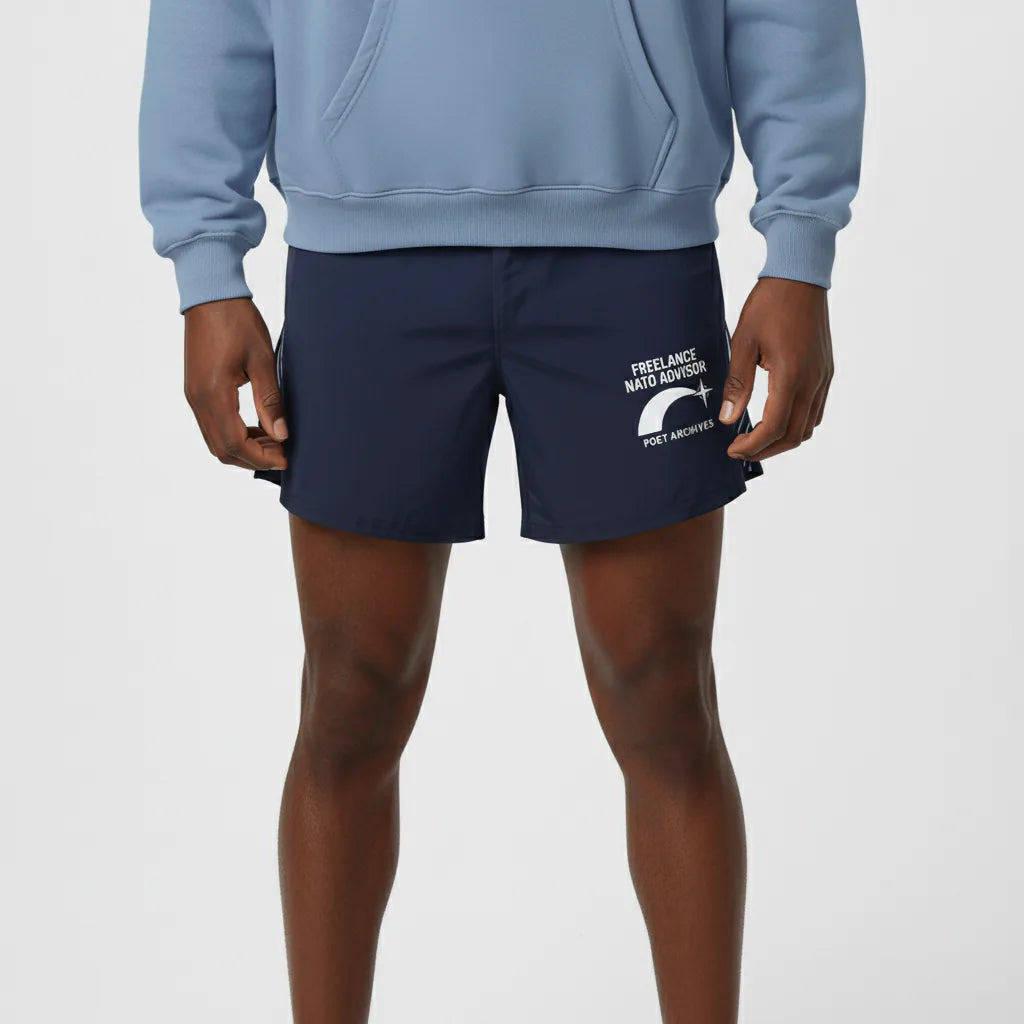Person wearing navy shorts with text and graphics on a plain background