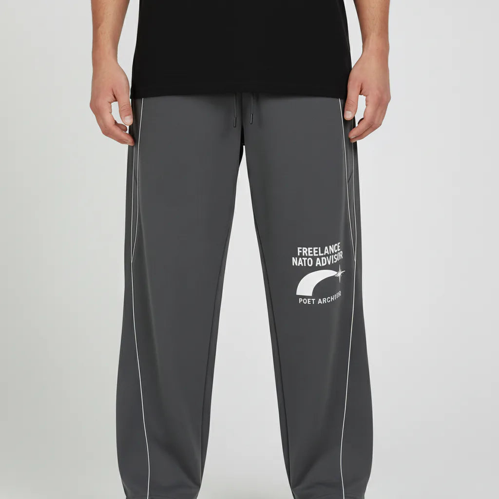 Person wearing dark gray pants with text and logo on a light gray background