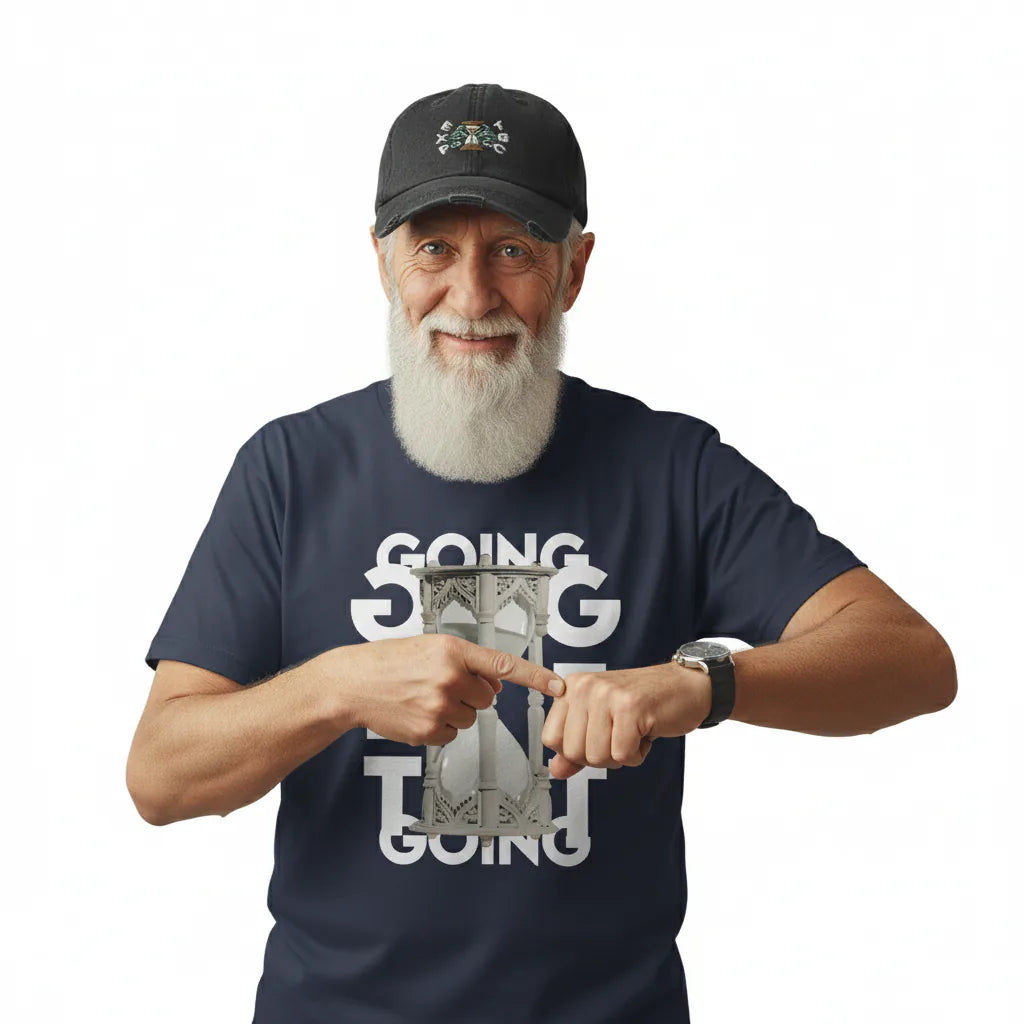 Man wearing a navy blue t-shirt with a graphic design and text, holding a small object.