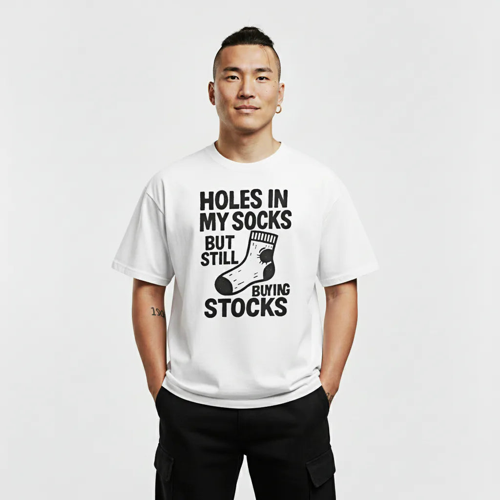 Person wearing a white t-shirt with text and graphic on a plain background