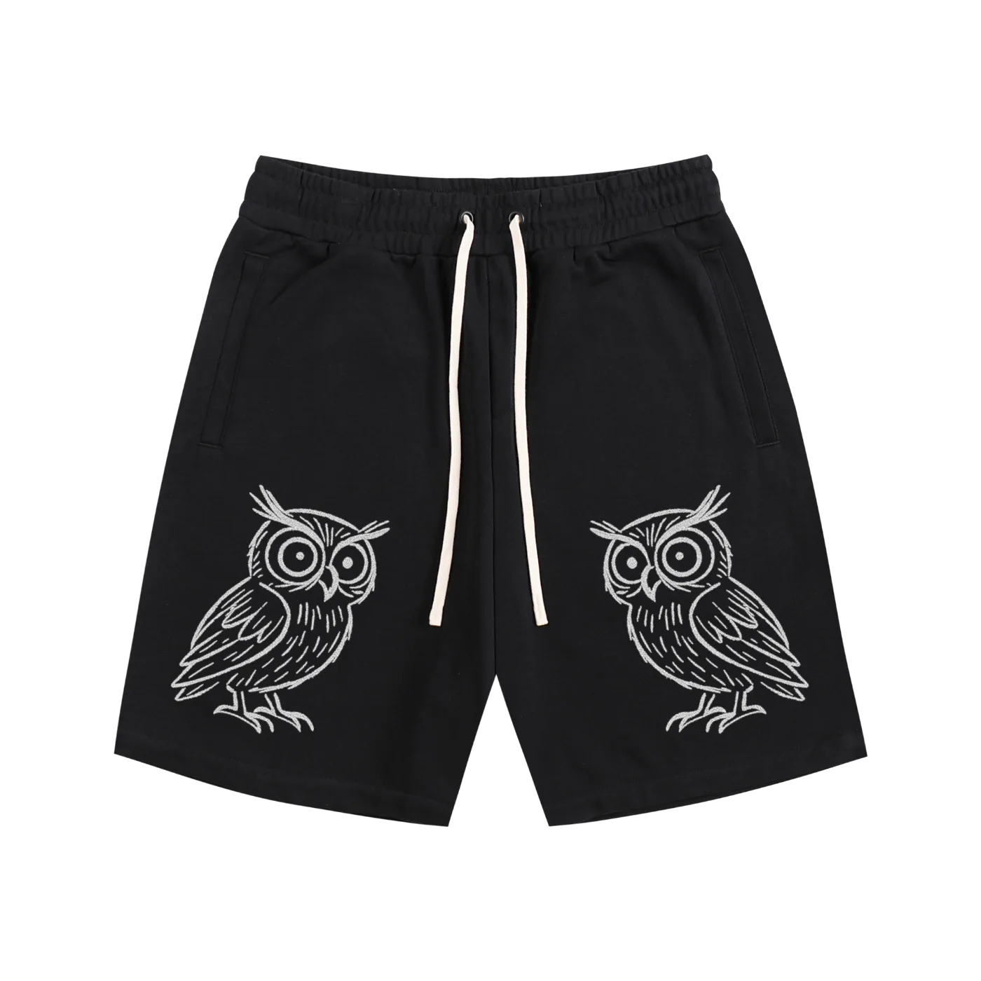 Black shorts with white owl designs on a white background