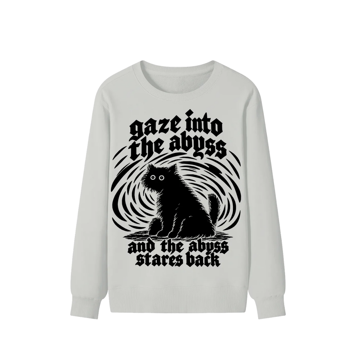 A light gray long-sleeve crewneck sweatshirt featuring a black graphic print of a cat sitting in front of a swirling vortex, with the gothic text 'gaze into the abyss and the abyss stares back'.