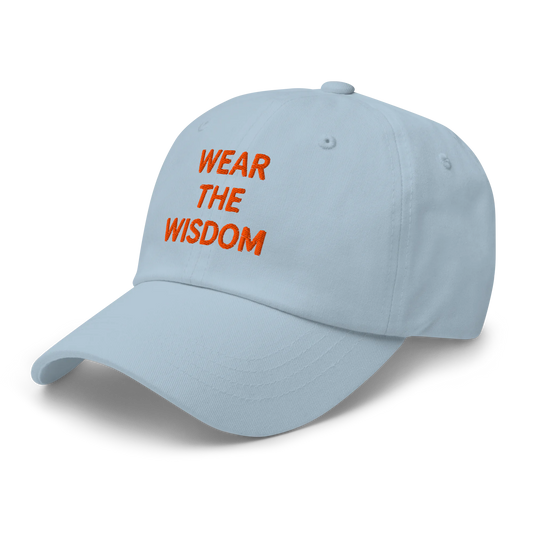 Light blue cap with 'Wear the Wisdom' text in orange on a white background