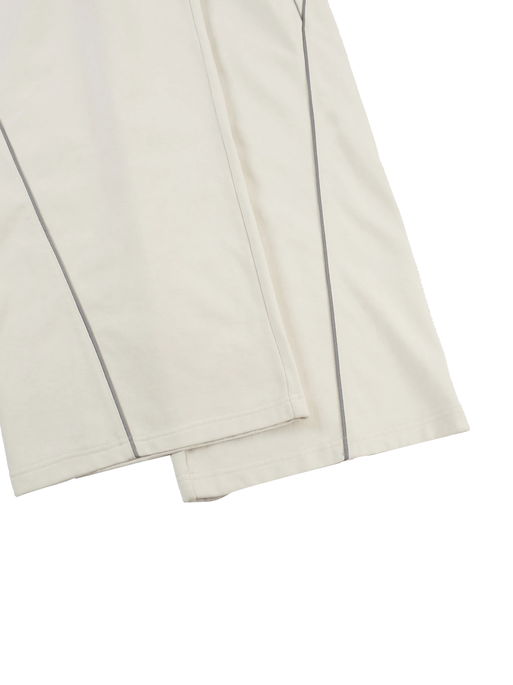 Folded white fabric with a subtle pattern on a white background