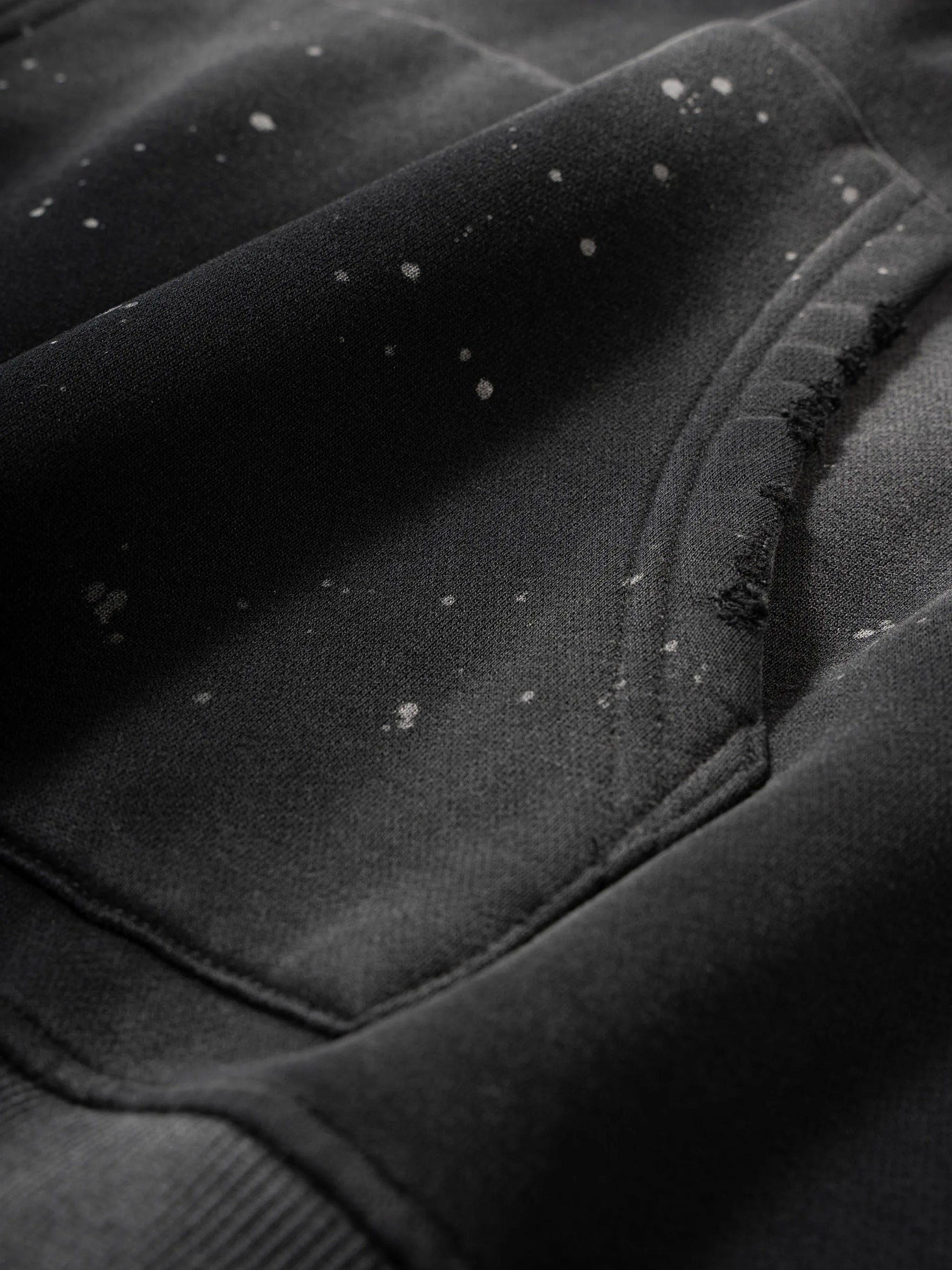Close-up of a textured black surface with visible fibers