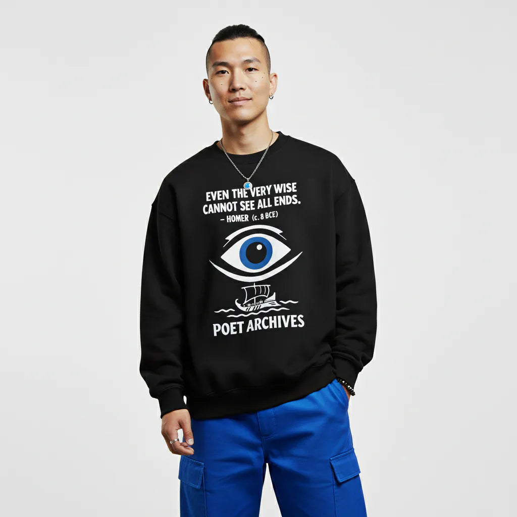 Person wearing a black sweatshirt with text and an eye design on a white background