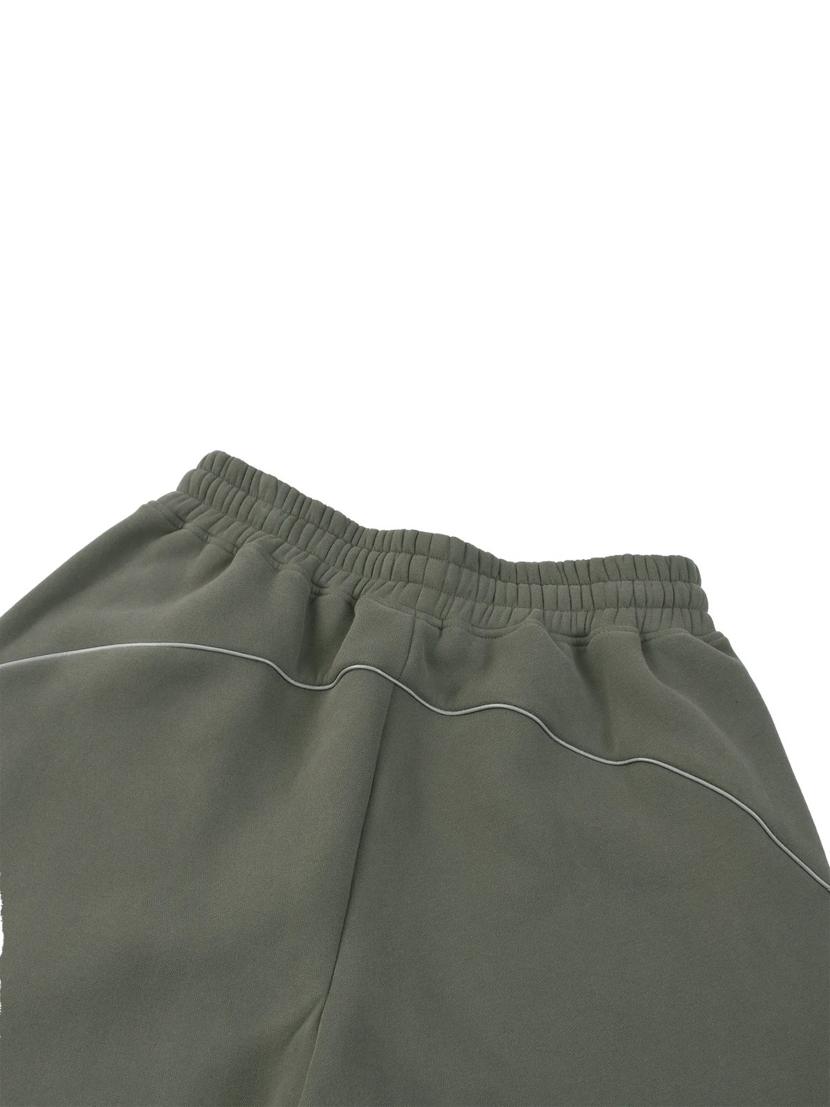 Close-up of the waistband and upper front of olive green sweatpants with thin white contrast piping, shown against a plain white background.