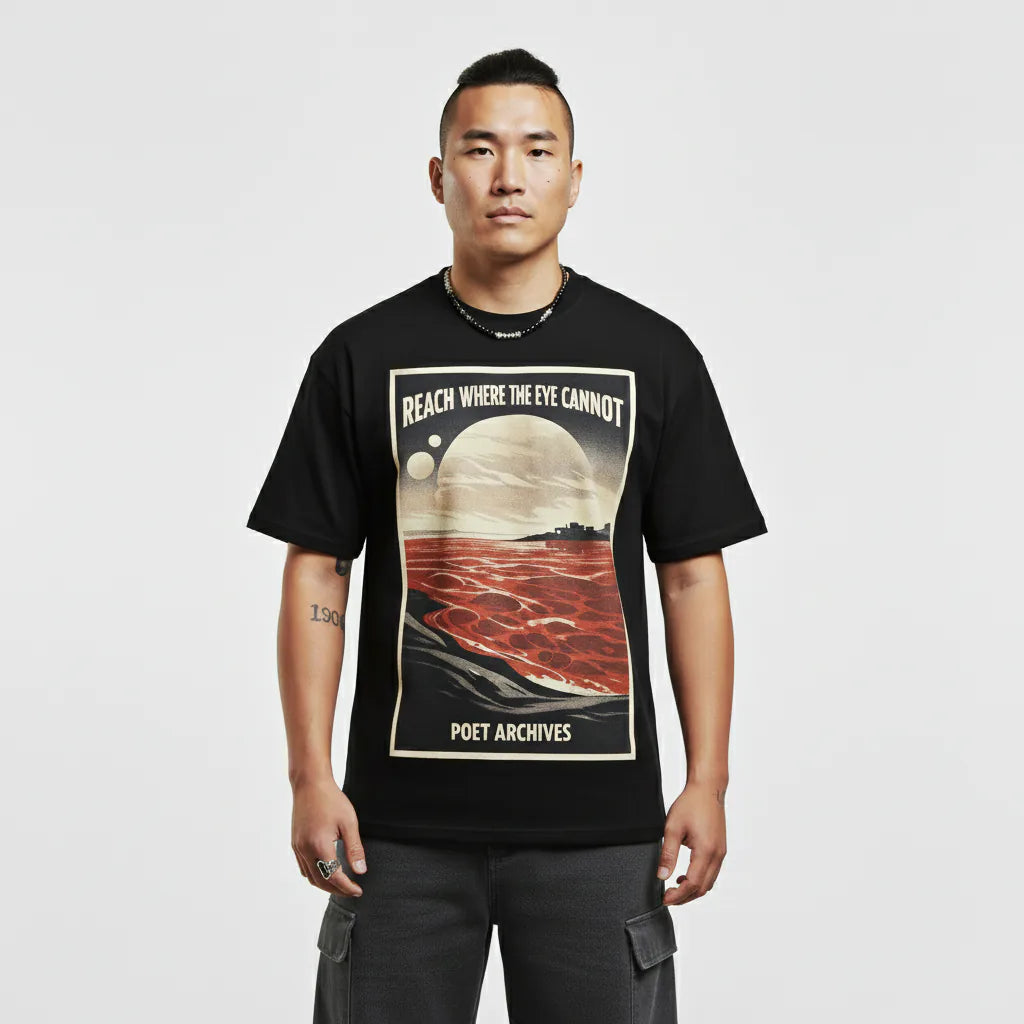 Person wearing a black t-shirt with a graphic design and text on a plain background