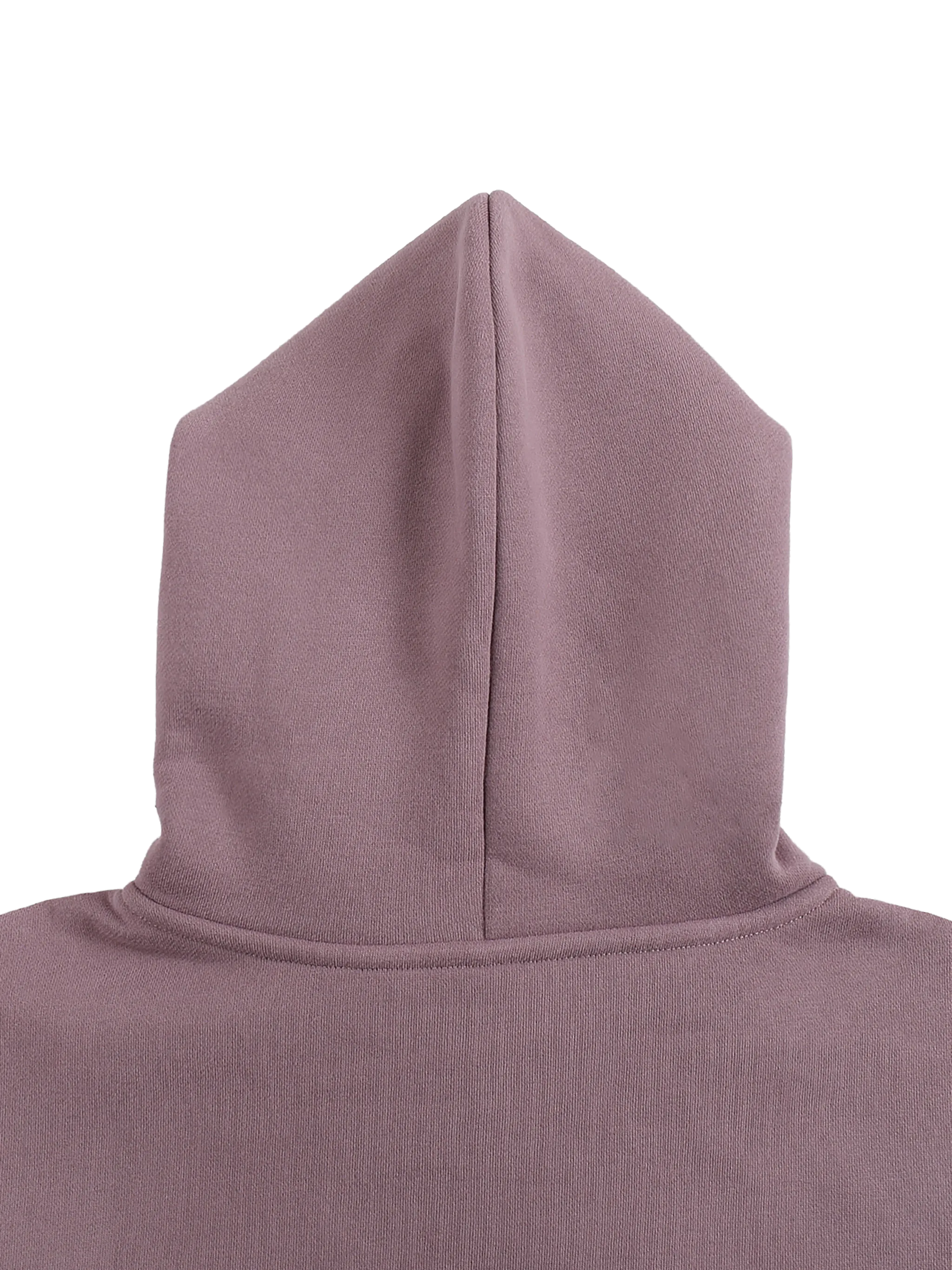 Close-up of a hooded garment in a neutral color on a white background