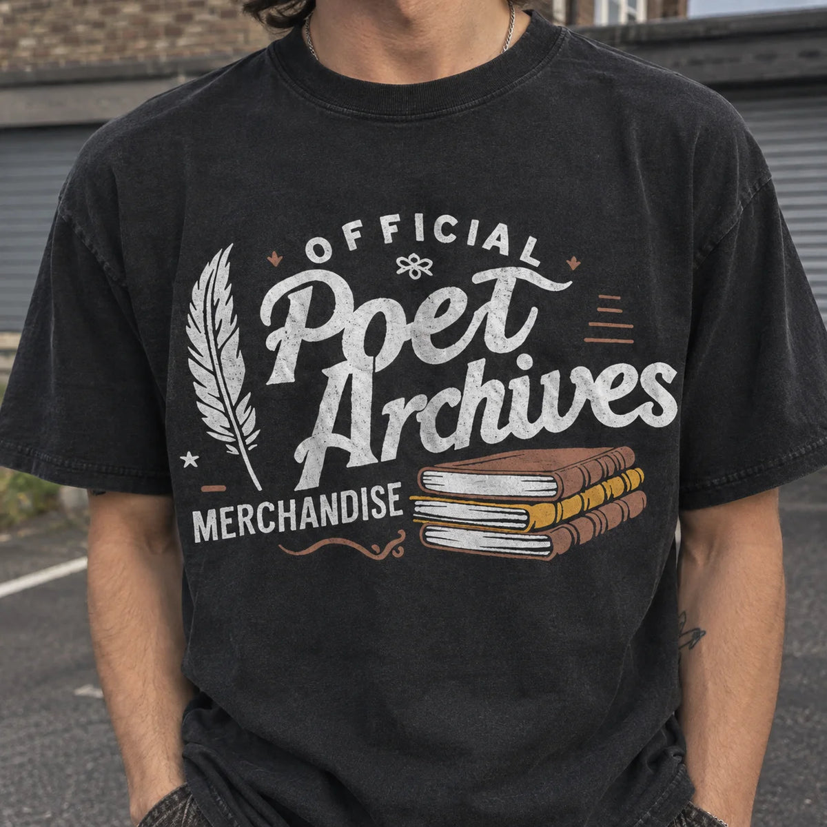 A person wearing a faded black graphic t-shirt with 'Official Poet Archives Merchandise' printed in white, brown, and gray on the front, set against an outdoor background.