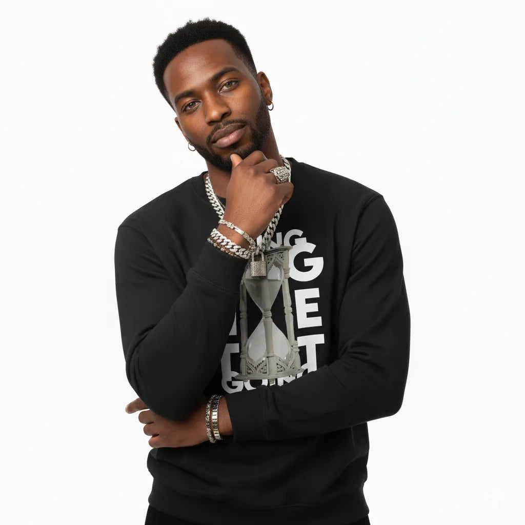 Man wearing a black sweatshirt with graphic design on a white background