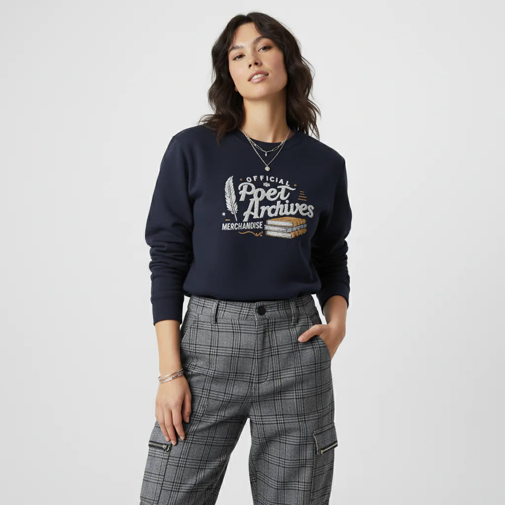 Woman wearing a navy sweatshirt with 'Official Poet Archives' text and plaid pants on a white background