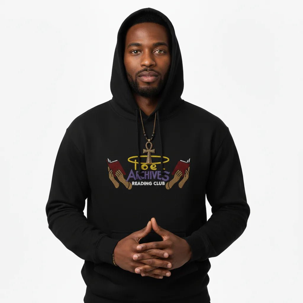 Person wearing a black hoodie with a graphic design on a white background